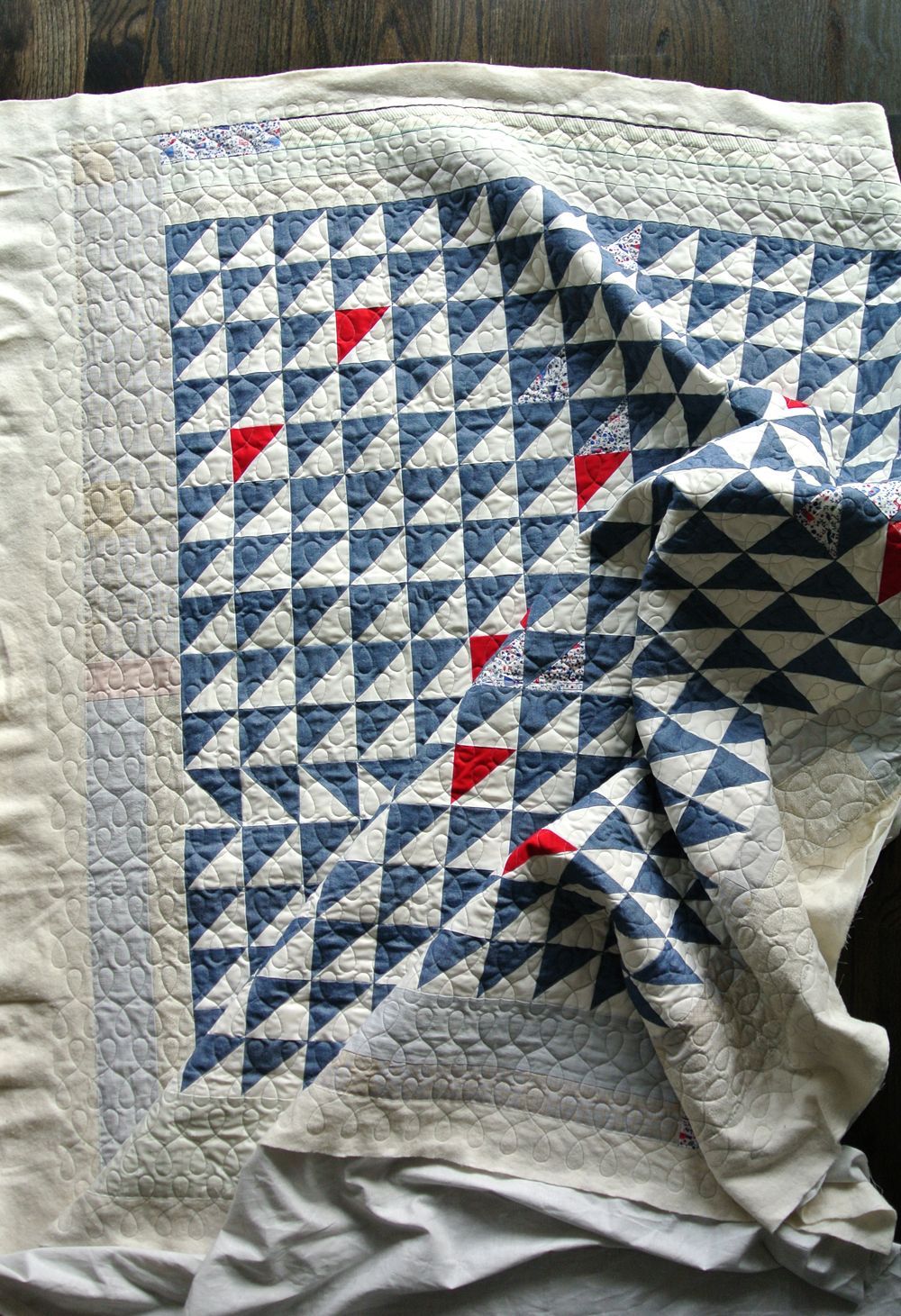 Quilting with denim - tricks, tips and lots of quilt inspiration. This Gee's Bend inspired quilt can be made using this FREE half square triangle tutorial!