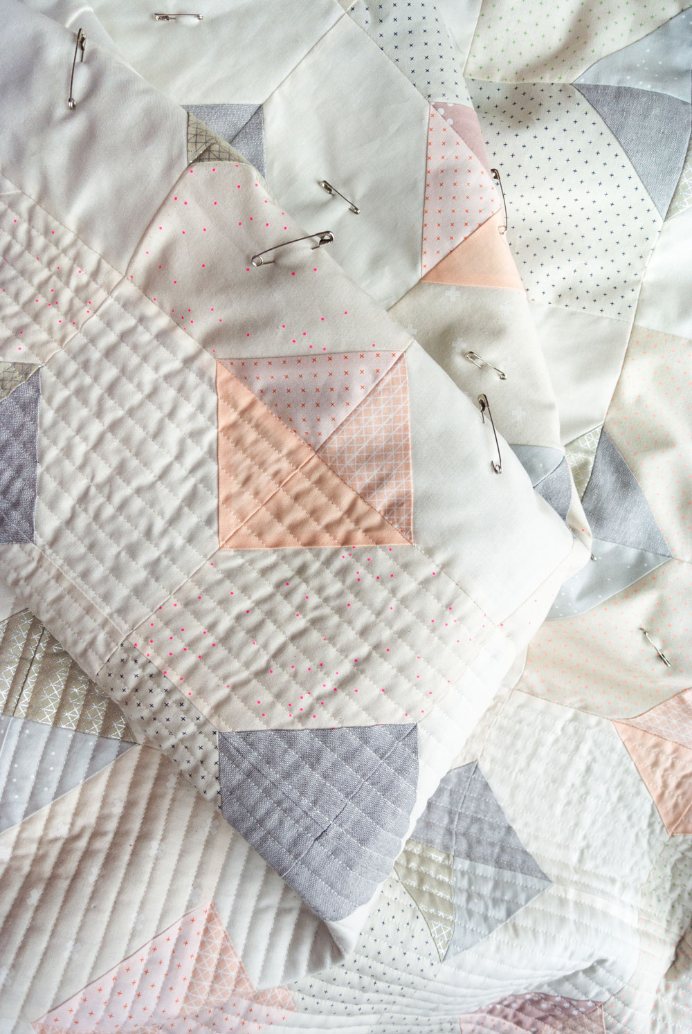 The Glitter & Glow quilt pattern comes in king, queen/full, twin, throw and baby quilt sizes. It's a simple beginner-friendly quilt pattern that is also scrap and fat quarter friendly!