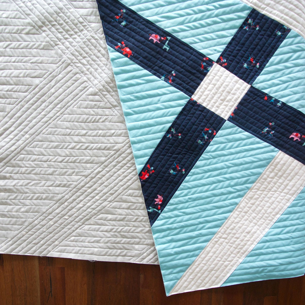 Learn the 6 easy steps for perfect straight line machine quilting. This Fishing Net quilt is an example of why you should sew in the same direction – to avoid wave-like pulling