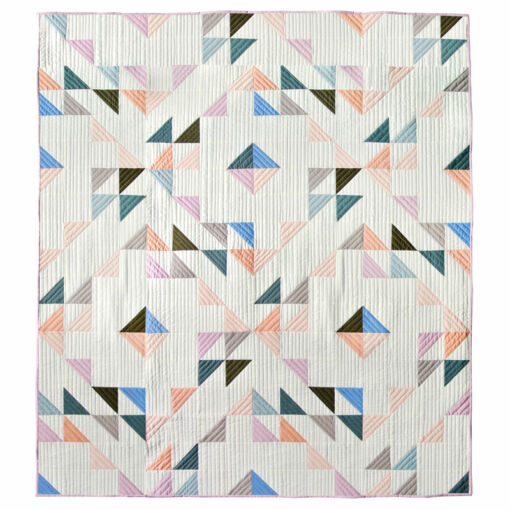 Summer Haze is a modern fat quarter quilt pattern that is beginner friendly and a great quilt pattern for using scrap fabric. Use the basic half square triangle to make this quilt! suzyquilts.com #quiltpattern #modernquilt