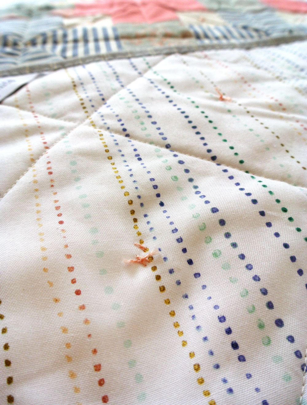 How to tie a quilt with a modern twist! | Suzy Quilts https://suzyquilts.com/how-to-tie-a-quilt-with-a-modern-twist
