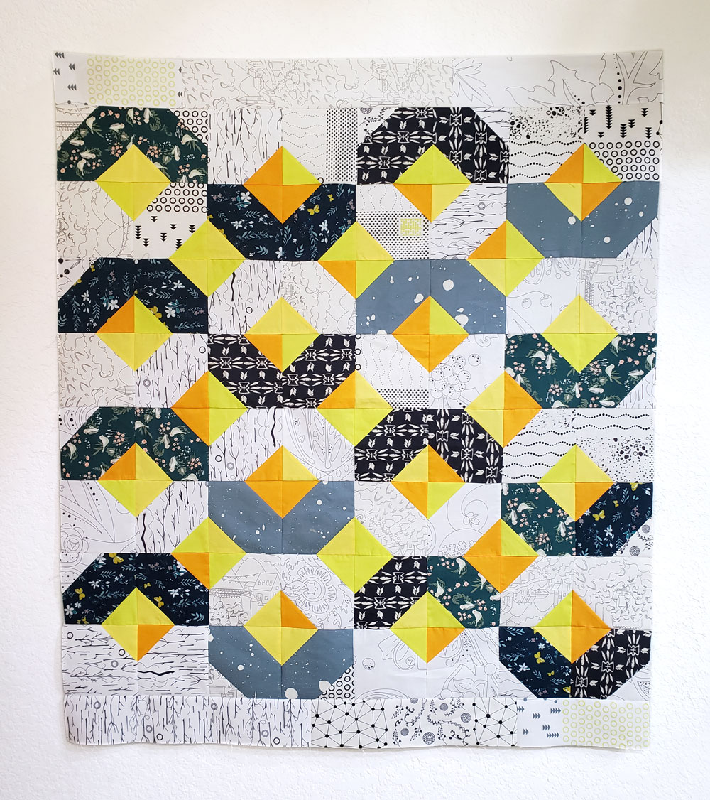 Yellow, black and white glitter quilt