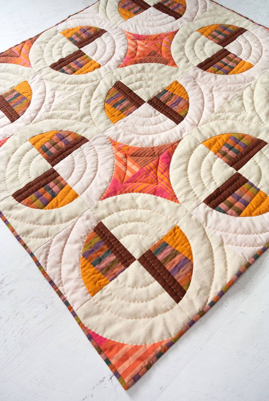 Modern Fans is a bold, modern quilt pattern that includes king, queen, twin, throw and baby quilt sizes as well as a video tutorial! This baby quilt uses lots of different subtle textures.