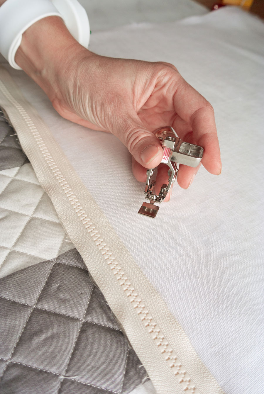 Elegant Quilted Pillow DIY! Sew a quilted zipper pillow with this step by step tutorial. I'll walk you through how to baste and quilt your pillow top, sew a zipper, and finish the pillow beautifully!
