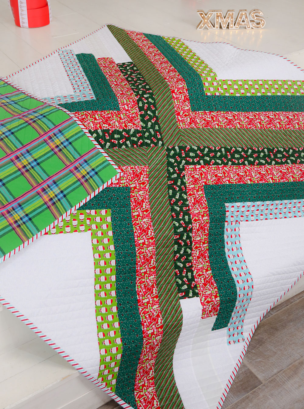 The Sugar POP quilt pattern is a PDF download that includes throw, baby and a pillow size. This modern design works well as a gradient or with fabric scraps. This pattern makes the perfect Christmas holiday quilt too!