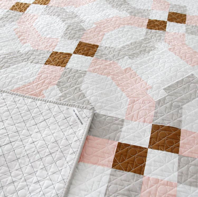 Do you have questions about hiring a longarm quilter? This in-depth guide answers all of those questions from fabric to price to turnaround time.