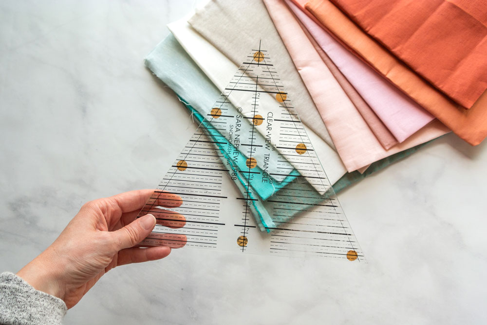 Tips and video tutorials on how to quilt with triangle blocks for the Perennial Quilt by Suzy Quilts | suzyquilts.com