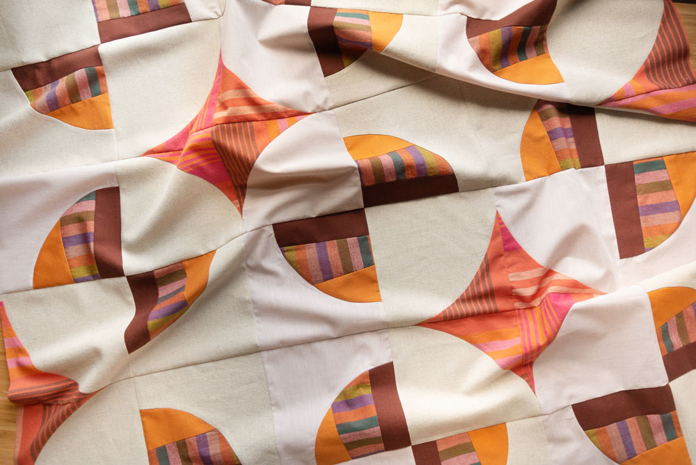 How to sew curves tutorial - Suzy Quilts | Modern Fans is a bold, contemporary quilt pattern that includes king, queen, twin, throw and baby quilt sizes as well as a video tutorial!