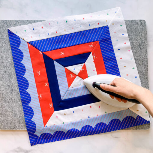 The Reflections Wall Hanging and Pillow extension pattern is a beginner-friendly modern design. These two projects are perfect for a fat quarter bundle or using up scraps!