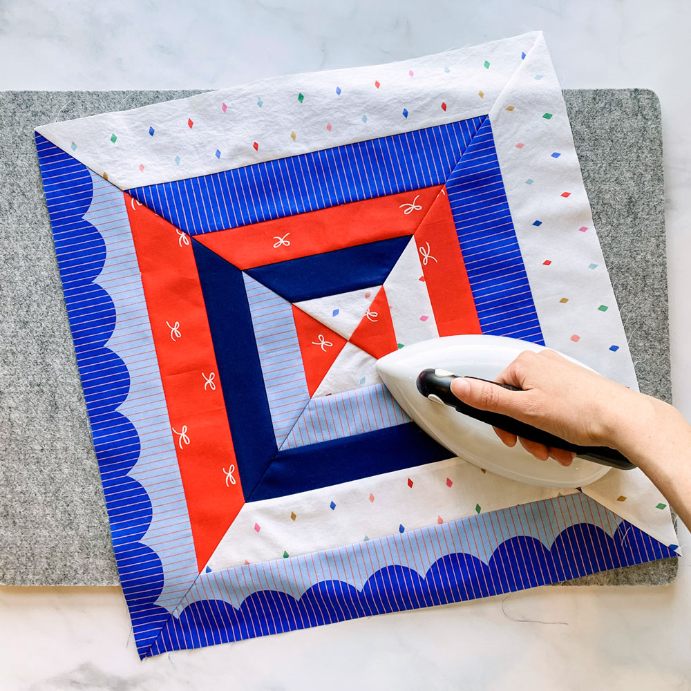 The Reflections quilt pattern is a beginner-friendly modern design that includes king, queen, full, twin, throw and baby quilt sizes. The Extension pattern includes a 30" wall hanging and a 18" pillow.