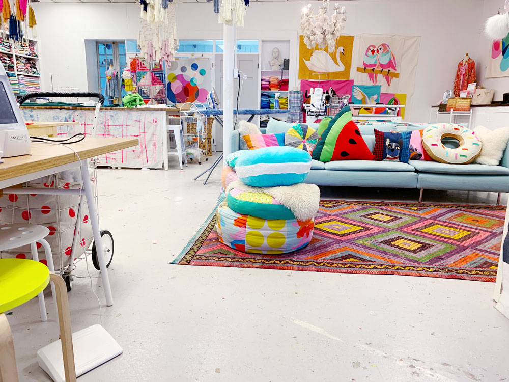 Annabel Wrigley is the founder of Little Pincushion Studio – a creative place that teaches sewing workshops to children as well as adults! Annabel is known for her colorful doodle quilts and bright fabric designs. suzyquilts.com #sewingclasses #kidsewing