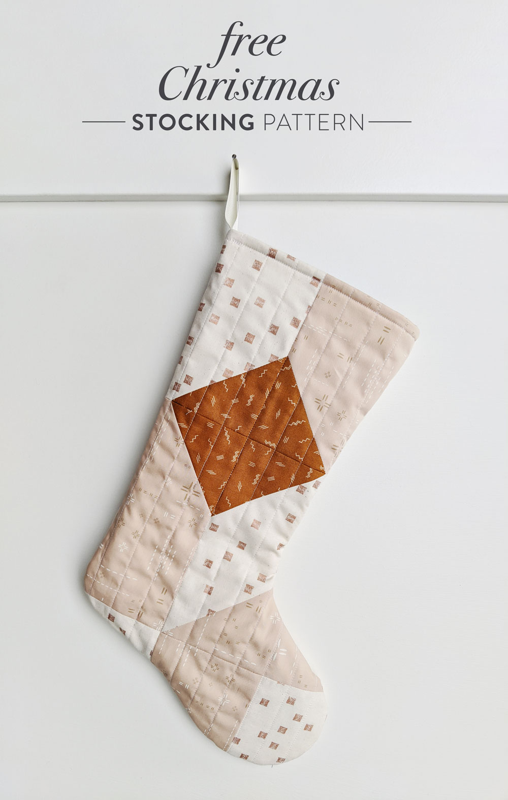 A free quilted Christmas stocking pattern right in time for the holidays! Sew a simple, modern stocking with this step by step tutorial. suzyquilts.com #DIYstocking #quilttutorial
