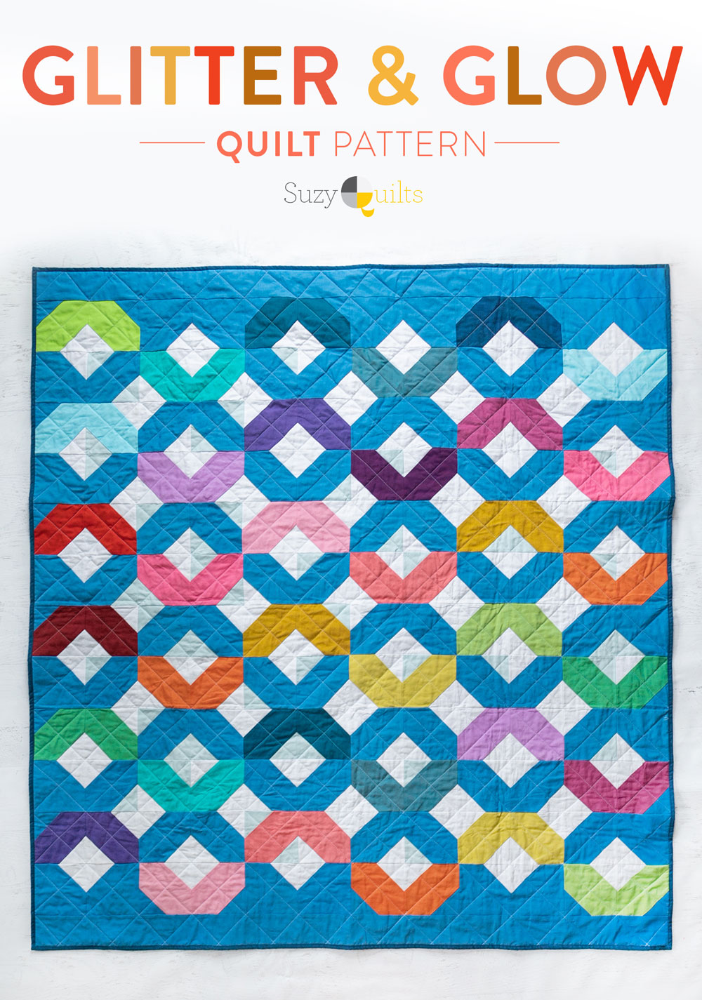 Make a Rainbow Quilt using this simple alteration to the Glitter & Glow quilt pattern. This is fat quarter friendly and great for newbie quilters and beginners. suzyquilts.com #rainbowquilt #rainbowbabyquilt