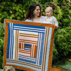 The Grow quilt pattern includes king, queen, twin, throw and baby quilt sizes. It is a modern interpretation of a traditional medallion quilt. suzyquilts.com