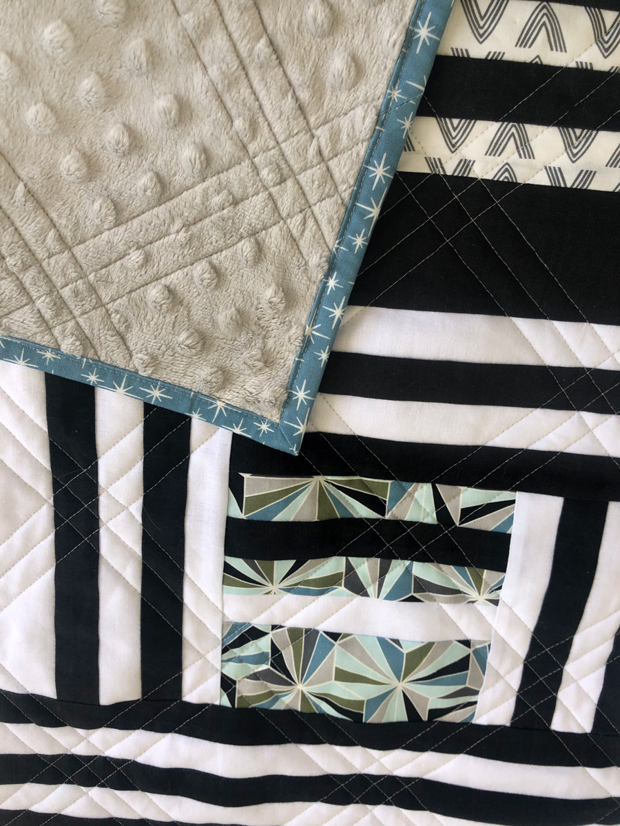 The Grow quilt pattern focuses on strip piecing – a simple quilting technique that creates a beautiful modern design. Beginner Friendly quilt pattern. See lots of quilt examples! suzyquilts.com #minkyquilt