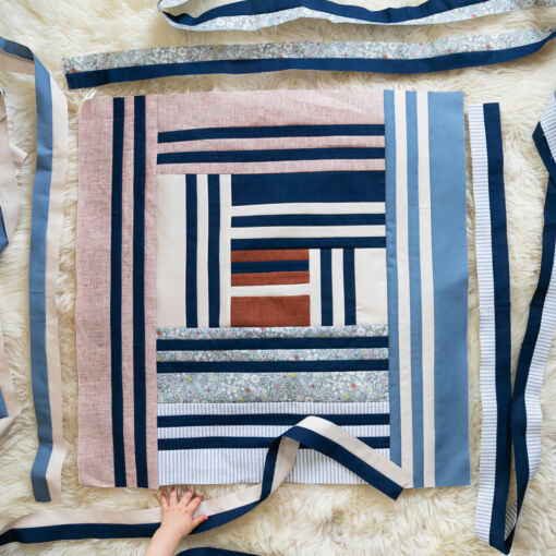 Grow is the first design in a series of four quilts that represent the four seasons in a year, as well as seasons in our lives. It includes fabric requirements and instructions for king, queen/full, twin, throw, and baby quilt sizes. This is an elegant modern medallion quilt. suzyquilts.com
