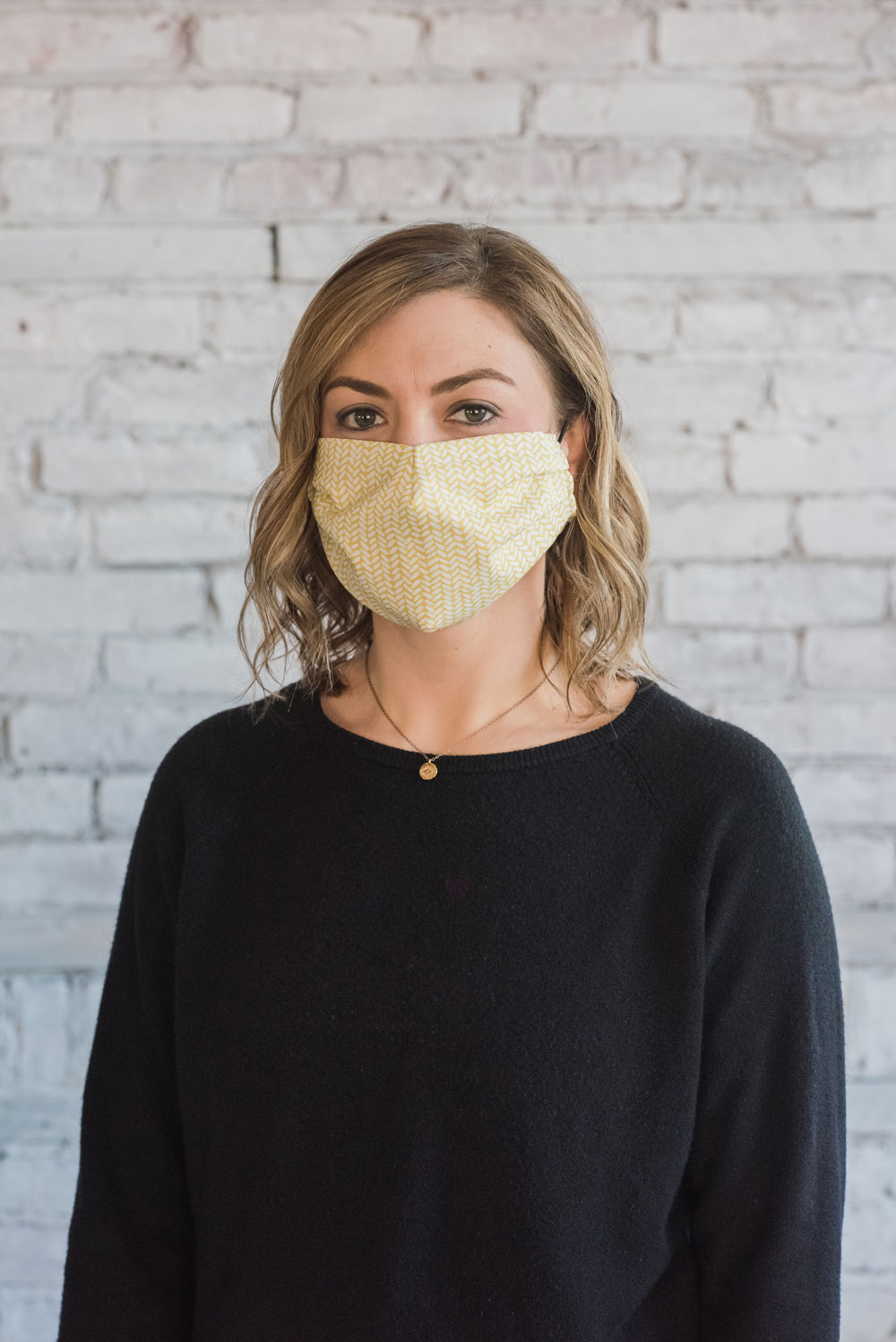 Our current global pandemic has created a shortage of medical masks. This free pattern with video explains how to sew a protective face mask with fabric. suzyquilts.com #facemaskpattern #sewfacemask
