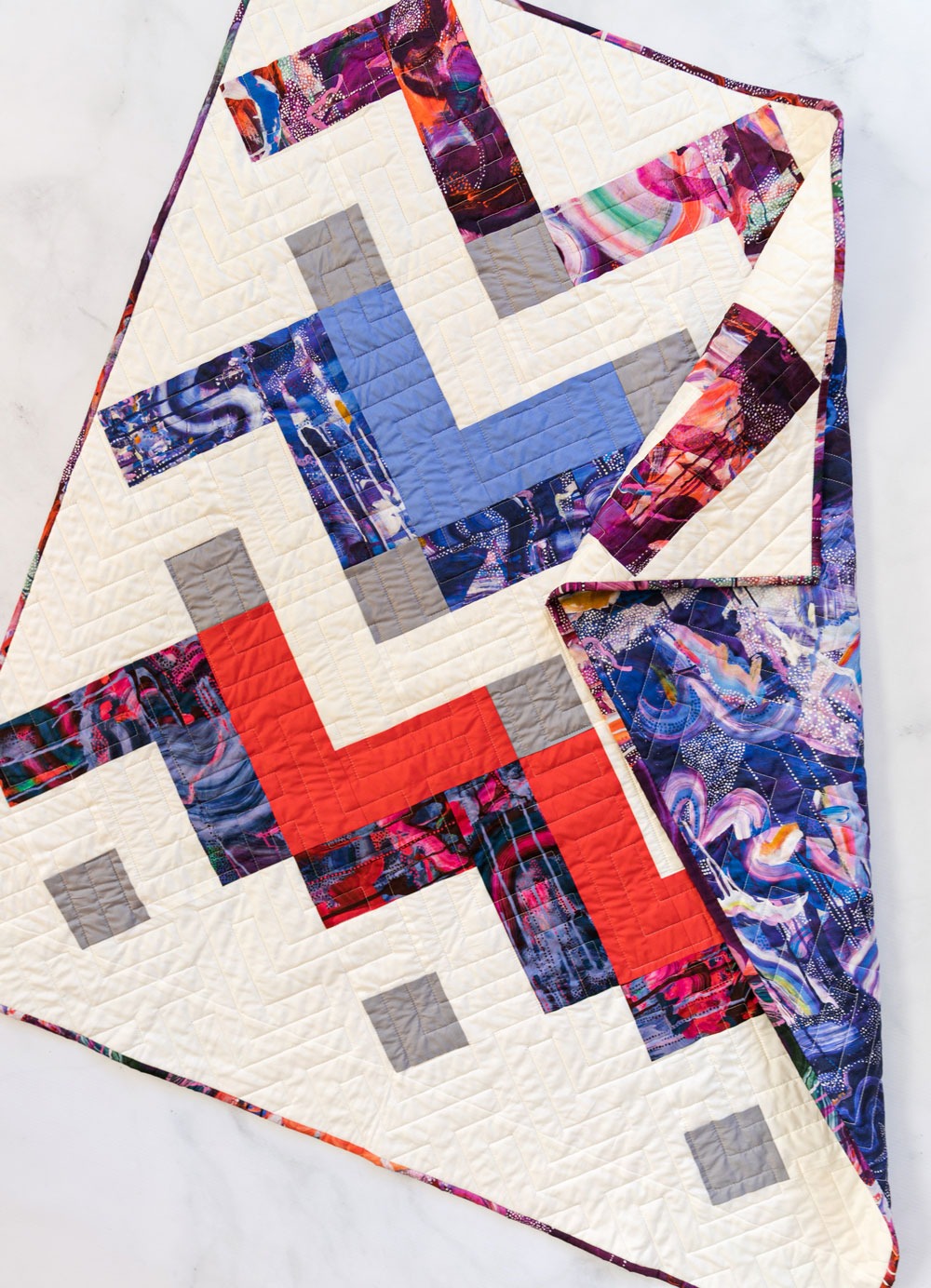 Thrive is a fat-quarter friendly modern quilt pattern using Liberty of London fabric. This instant PDF download comes in king, queen/full, twin, throw and baby quilt sizes. suzyquilts.com