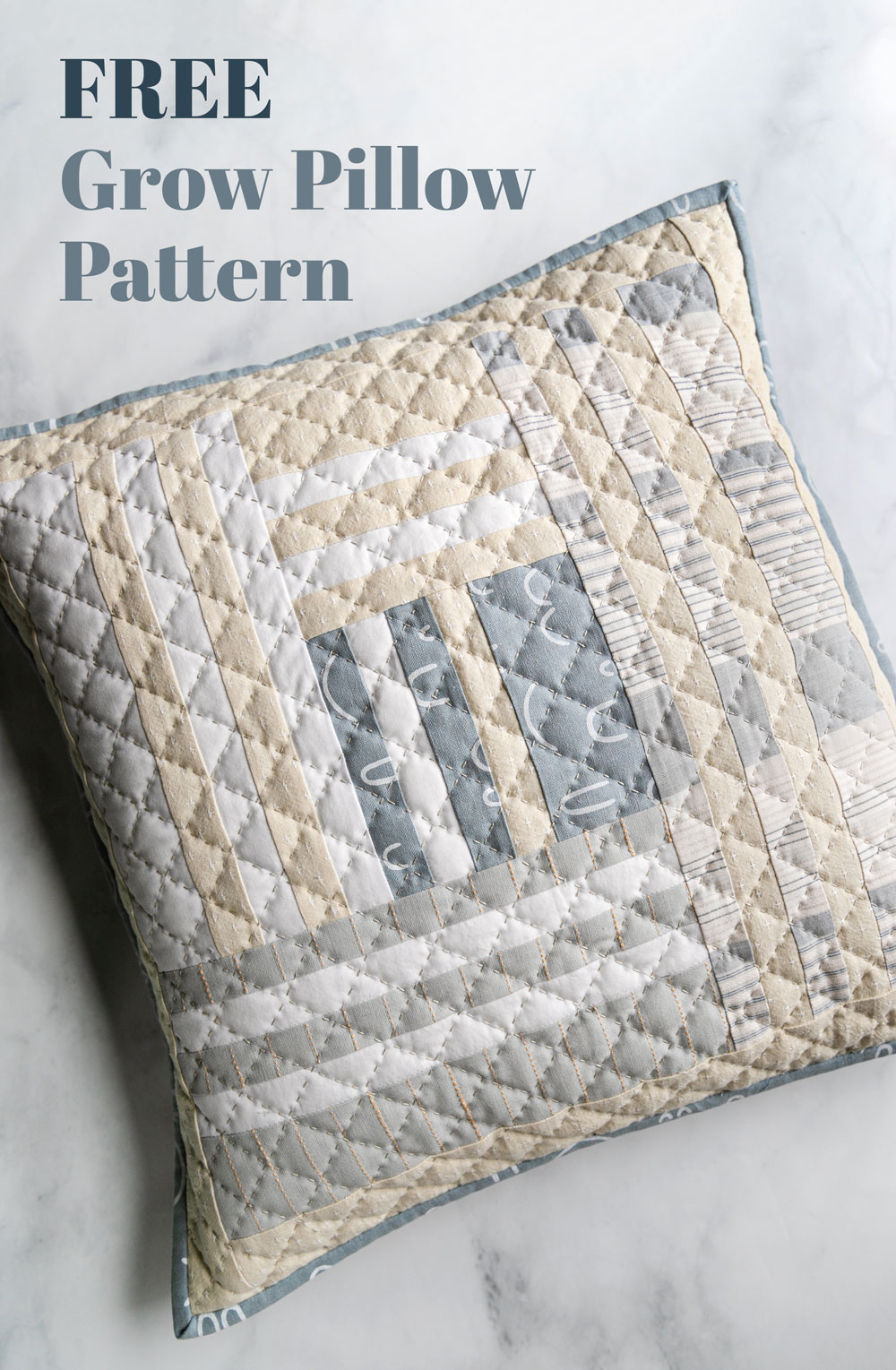 This FREE Grow pillow pattern gives you instructions to make a beautiful modern quilted pillow that finishes at 18-inches square. suzyquilts.com #quiltedpillow #freepillowpattern