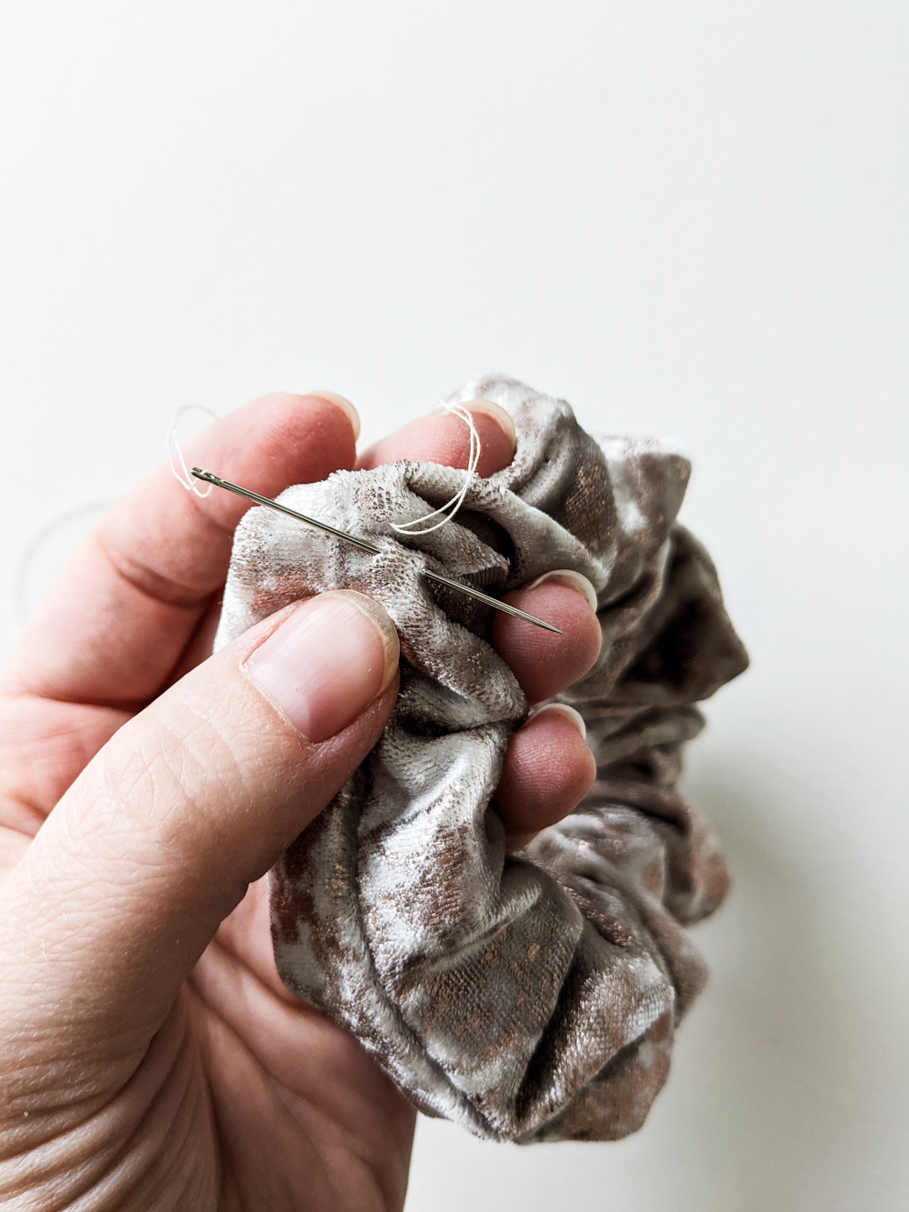 This quick and easy DIY scrunchie tutorial walks you through the simple steps of making a one-of-a-kind scrunchie