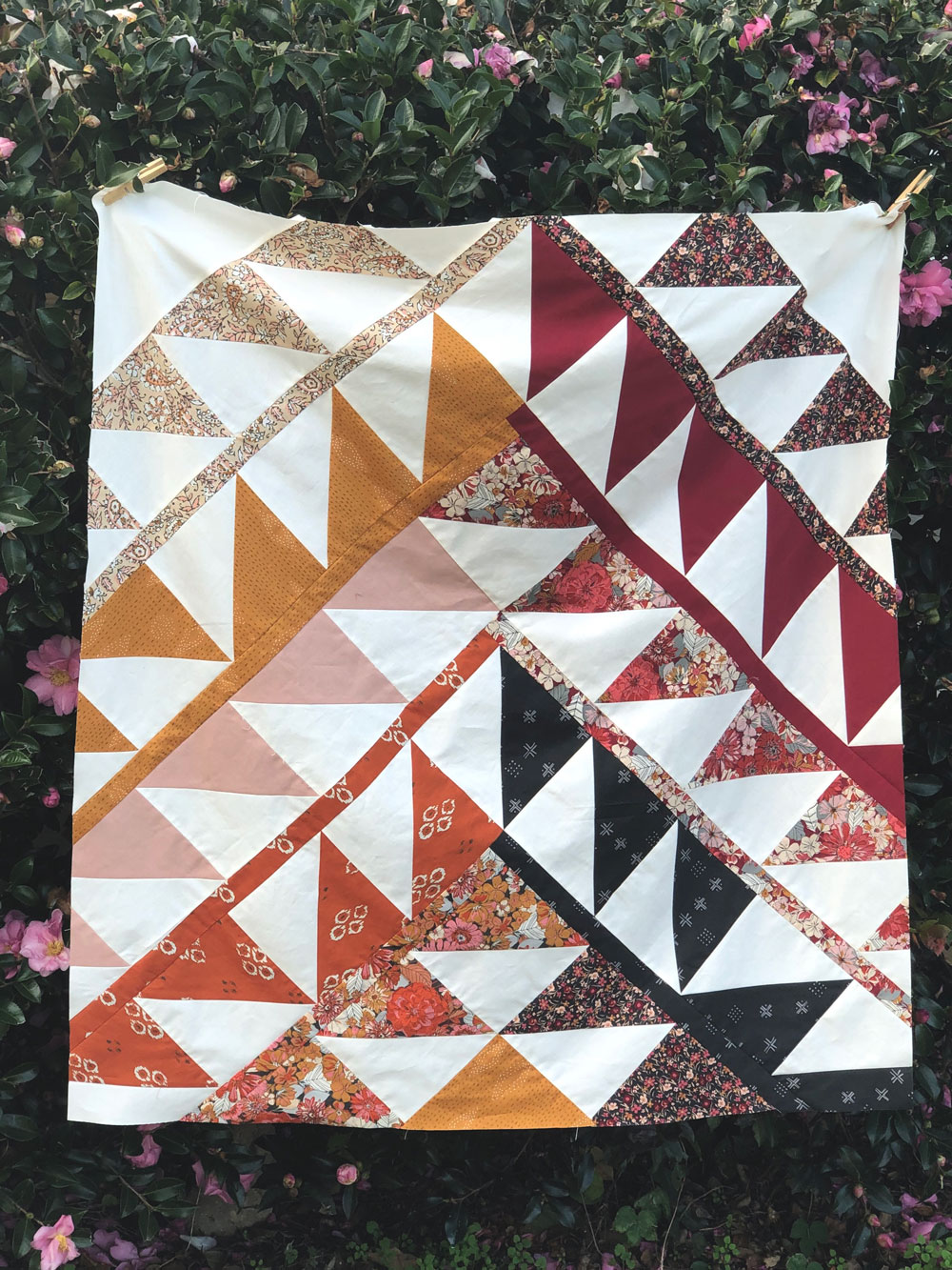 Gather is an HST modern quilt pattern with a unique twist! This instant PDF download comes in queen, twin, throw and baby quilt sizes. suzyquilts.com #quilt #babyquilt
