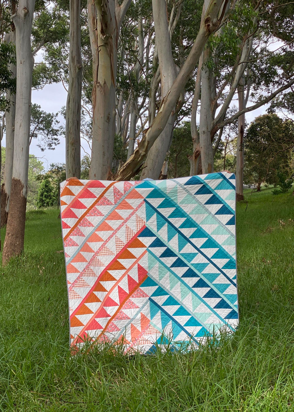 Gather is an HST modern quilt pattern with a unique twist! This instant PDF download comes in queen, twin, throw and baby quilt sizes. suzyquilts.com #quilt