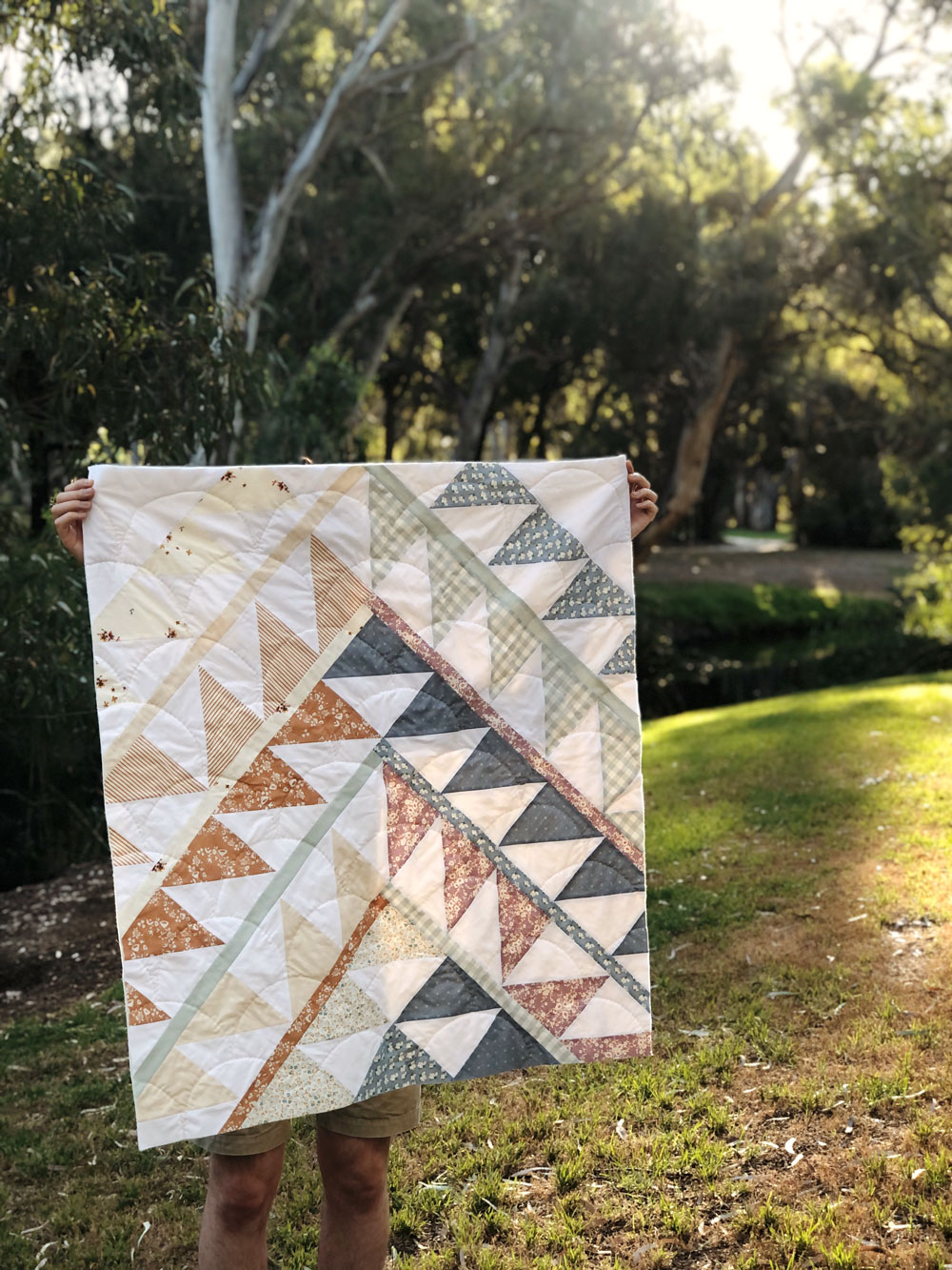 Gather is an HST modern quilt pattern with a unique twist! This instant PDF download comes in queen, twin, throw and baby quilt sizes. suzyquilts.com #quilt