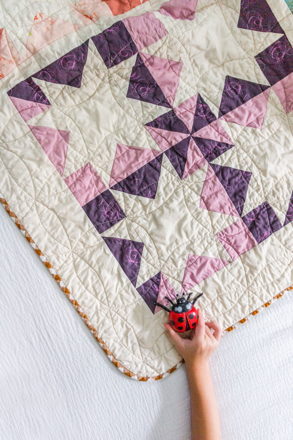 This  DIY tutorial explains how to print your child's art onto fabric to make a beautiful memory quilt using kids' artwork! suzyquilts.com #sewingtutorial #quilting