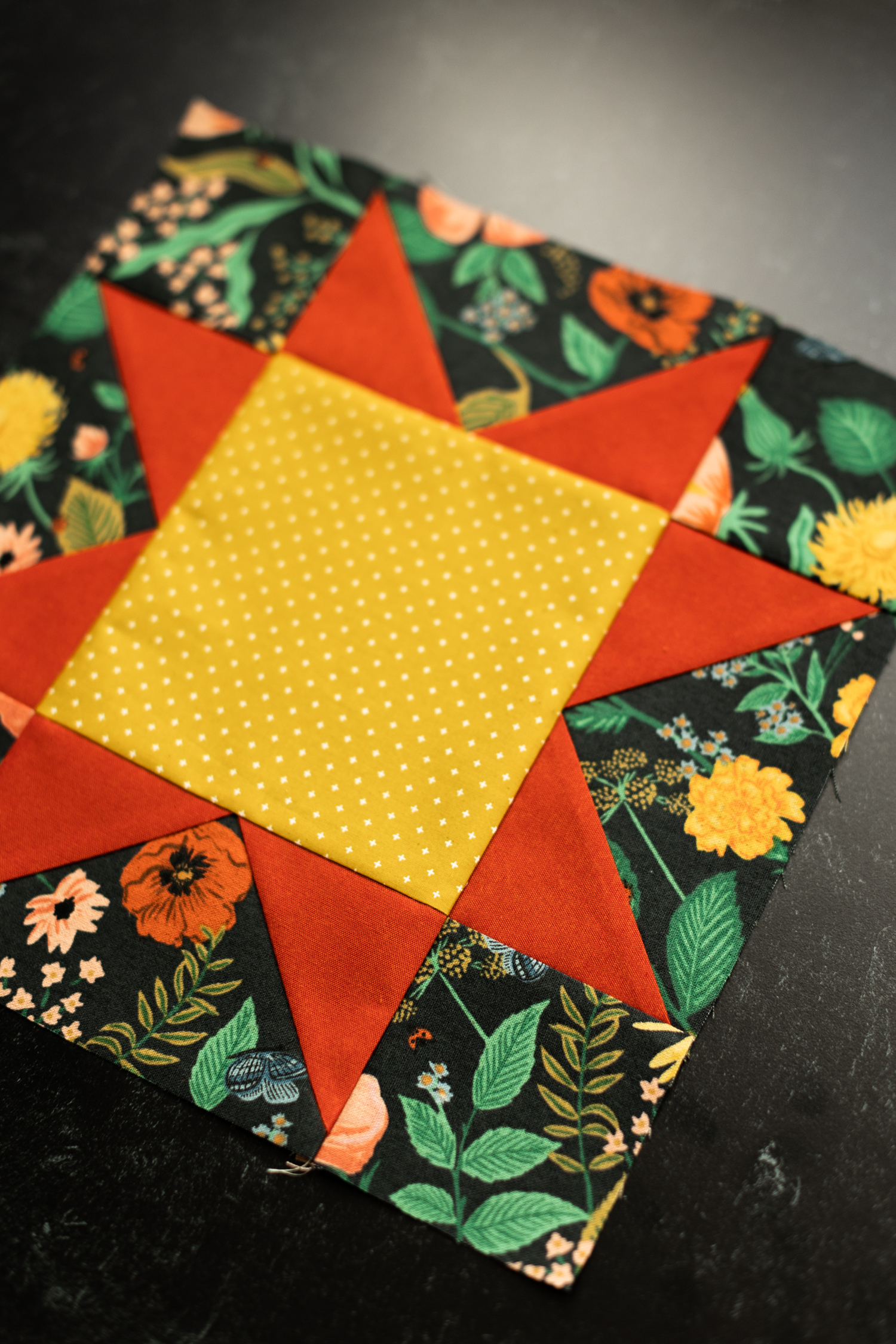 This DIY Patchwork Storage Cube Tutorial walks you through the steps of sewing a storage bin featuring a sawtooth star block
