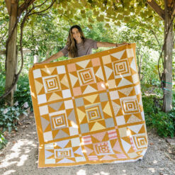 Shining Star quilt pattern download. This quilt pattern includes a full tutorial video and uses fat quarters or scraps!