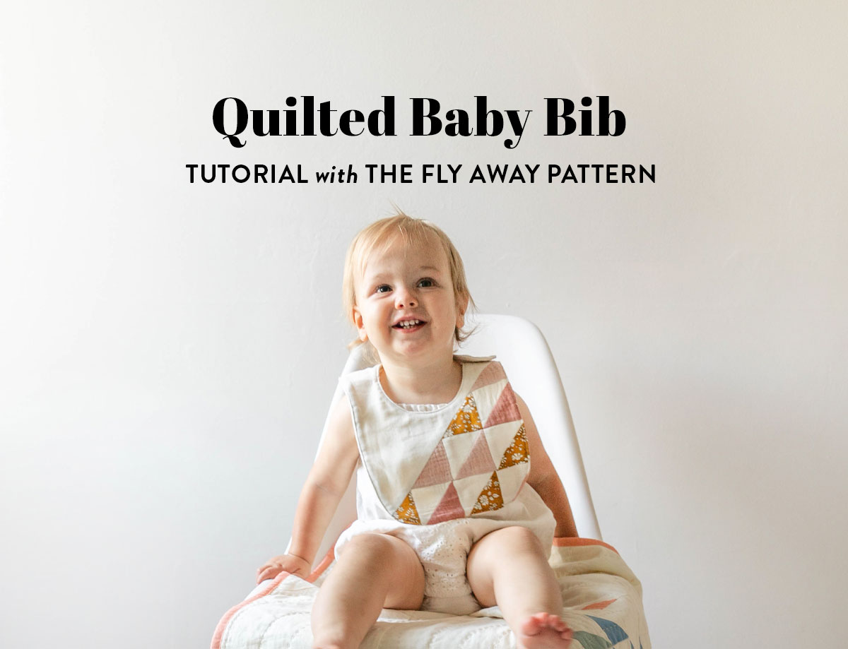 This simple quilted baby bib tutorial uses the Fly Away pattern and fabric scraps to make something beautiful! suzyquilts.com