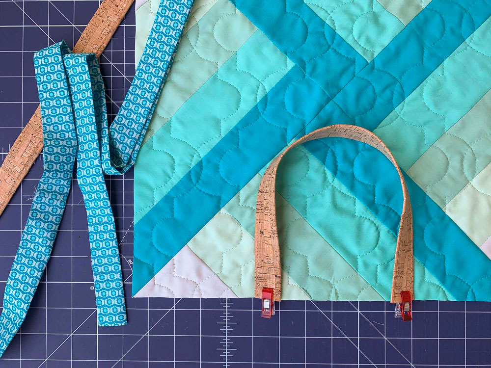 This is the best way to make a quillow (or quilted pillow pocket.) Use leftover scraps from the Adventureland quilt pattern and add a pocket! suzyquilts.com