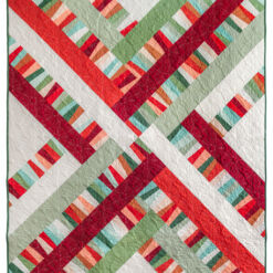 The Garland quilt pattern is perfect for precuts and scraps of fabric. It is a fast, beginner-friendly quilt pattern! suzyquilts.com #quilt