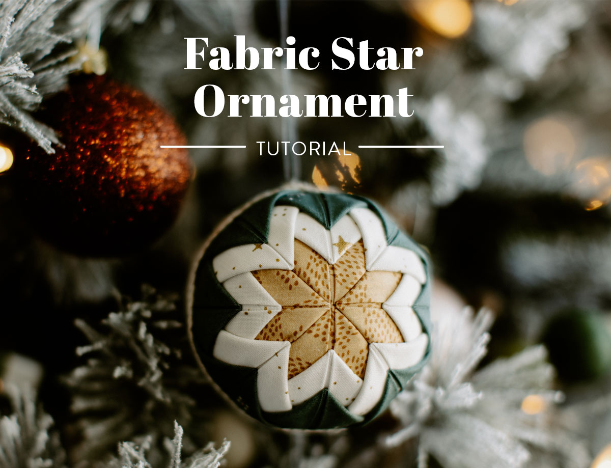 This simple no-sew fabric star ornament is something you can make with small scraps of fabric and sewing pins. No sewing involved! suzyquilts.com