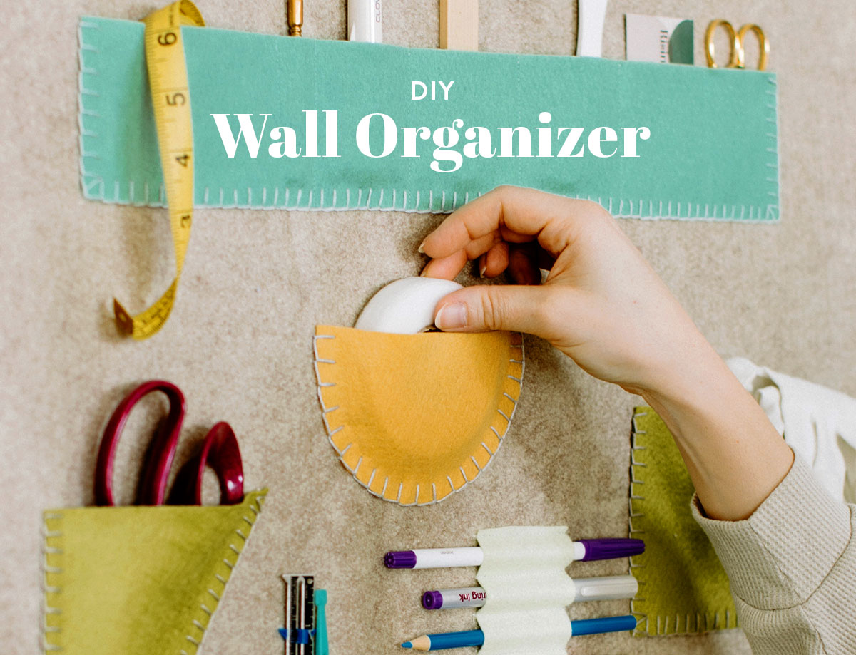 This DIY wall organizer tutorial guides you through creating a one-of-a-kind wall hanging for organizing all your crafting notions! suzyquilts.com