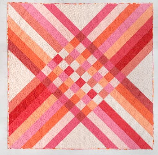 Star Crossed Quilt Pattern: A Star Crossed quilt in pink solid fabrics. #quilting suzyquilts.com
