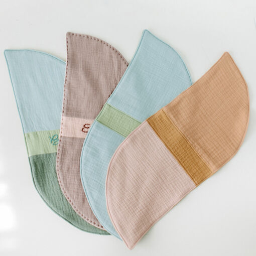 The Fronds Pattern Baby Bundle includes the Fronds quilt pattern with queen, twin, throw, and baby sizes, plus patterns for a burp cloth and 3D petal ball. suzyquilts.com