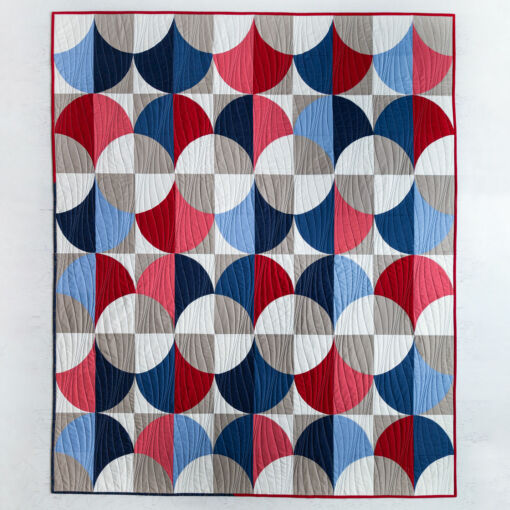 The Fronds quilt is a beginner curves quilt pattern that includes queen, twin, throw, and baby quilt sizes - suzyquilts.com