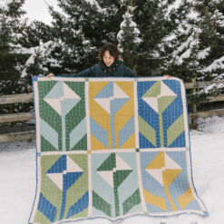 Spring themed Wildflower kit made with blue, green, and yellow fabrics. #sewing #quilting suzyquilts.com