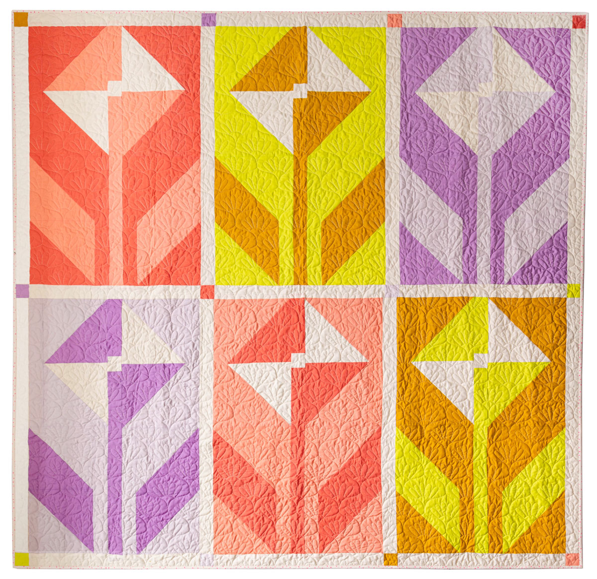 A Wildflower quilt made using light purple, yellow, and orange fabrics. #quilting #sewingdiy suzyquilts.com