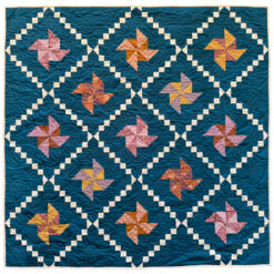 Tiny Pinwheels quilt pattern in navy at suzyquilts.com